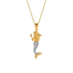 14k solid gold mermaid pendant with rhodium scales holding .03ct diamond with 18" chain.